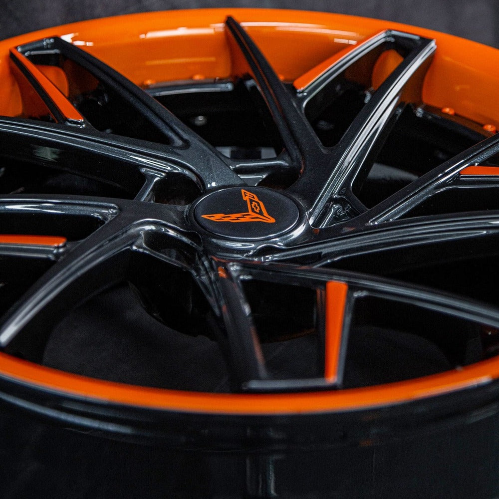Detail of orange and black forged Corvette Z51 wheels – RV-DS74 center cap