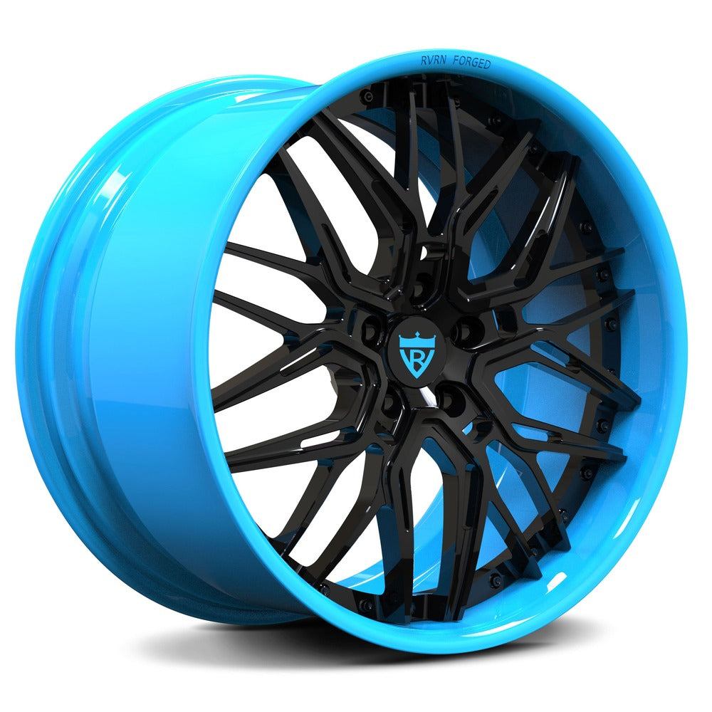 Blue custom forged wheel with black accents, featuring a contemporary design for high-performance vehicles.