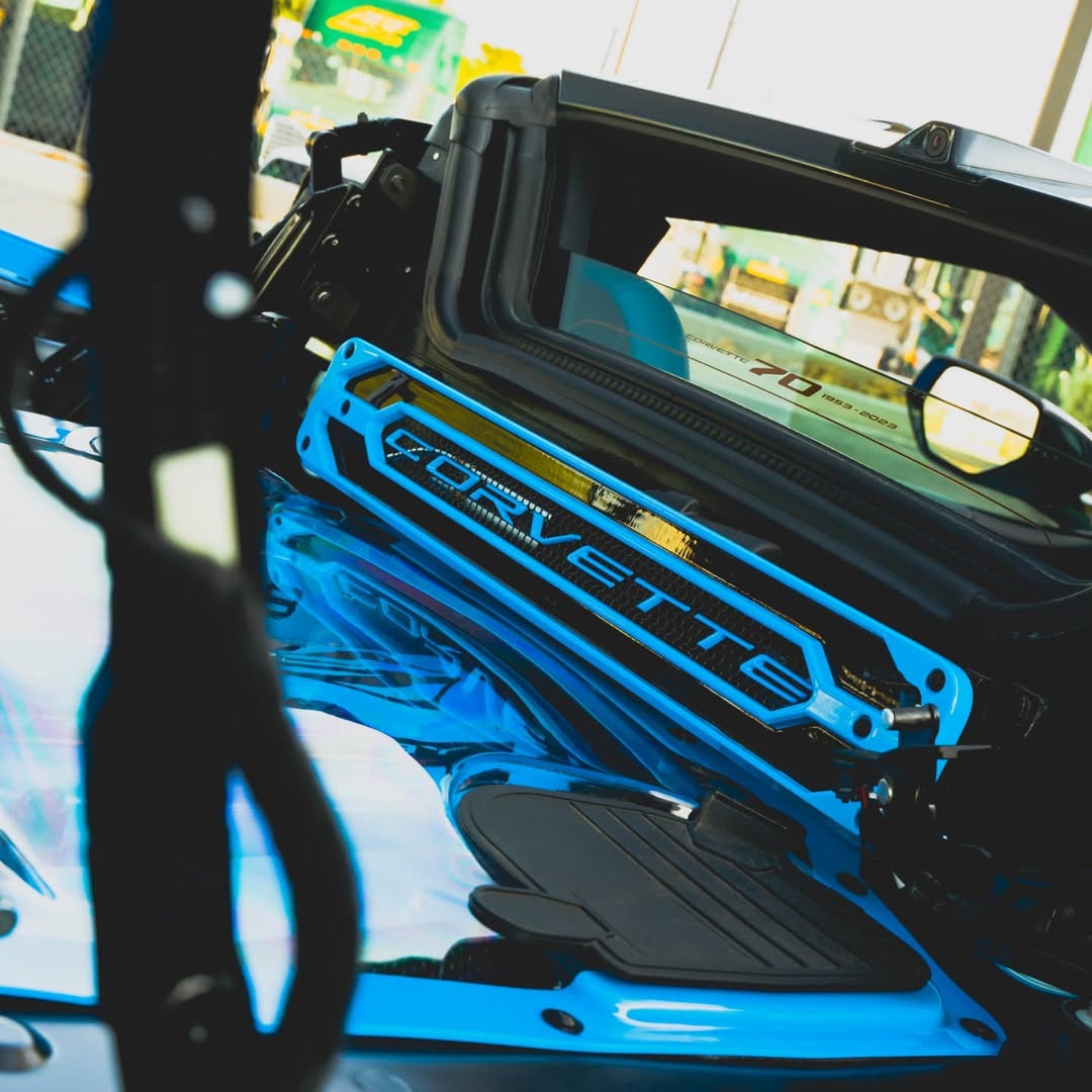 Inside view of a Corvette C8 showcasing the custom blue accents and modern interior design.