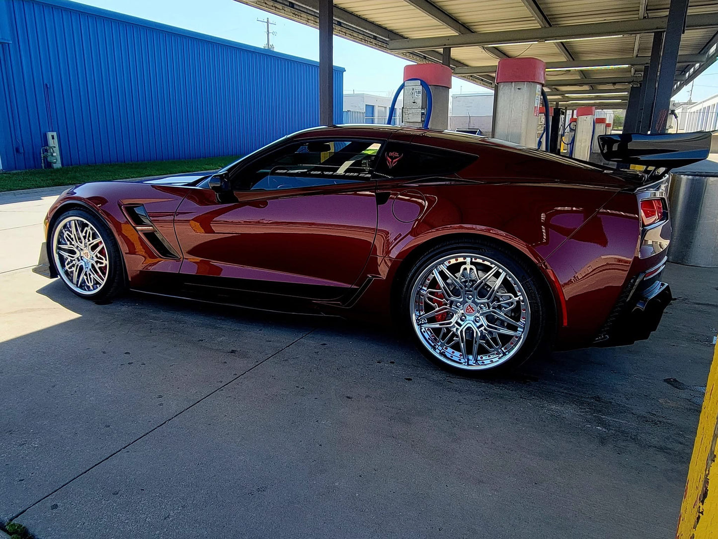 Aftermarket forged and chrome wheels for a red 2017 Corvette C7 Grand Sport models