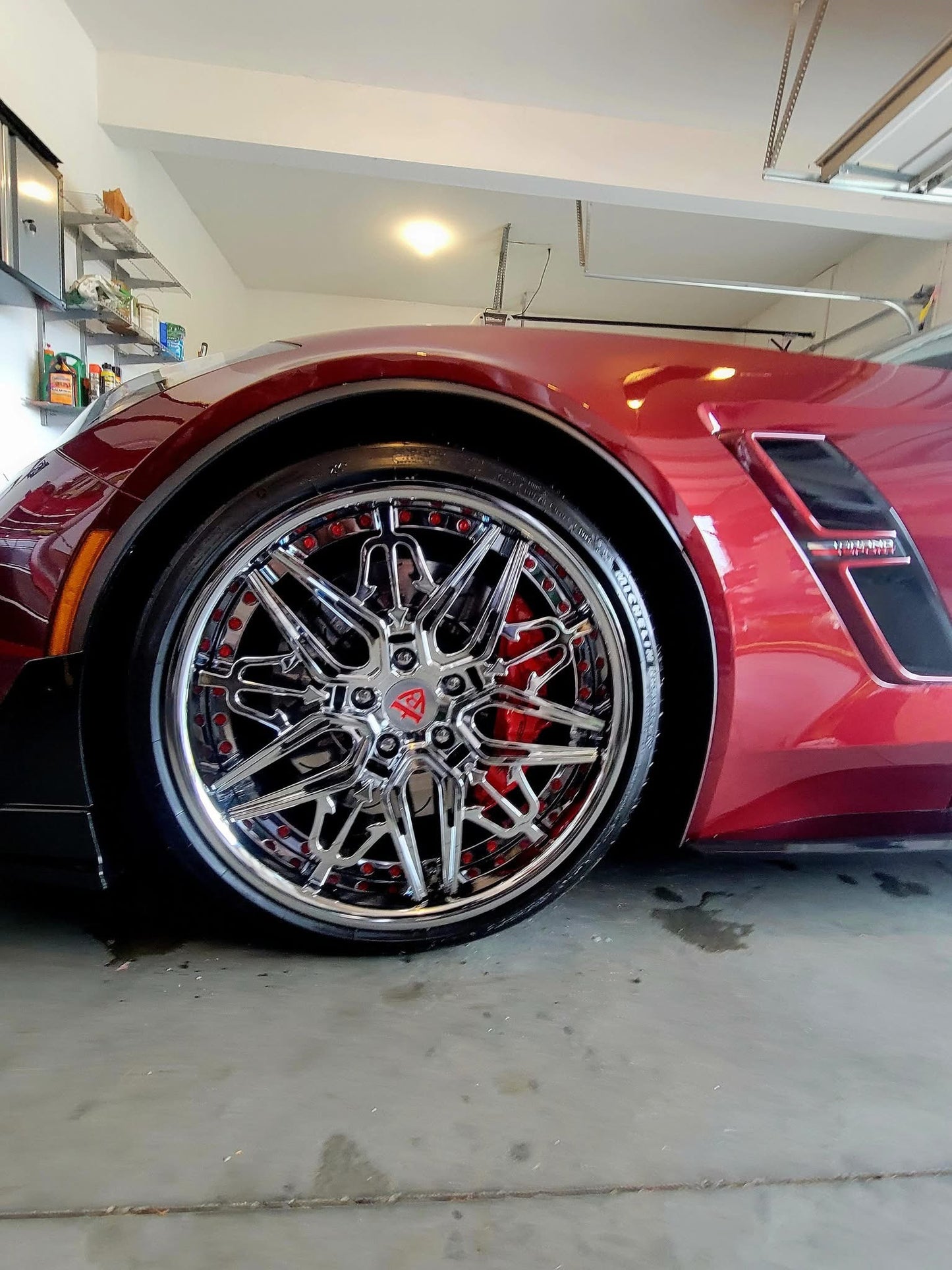 Aftermarket forged and chrome deep dish wheels for a red 2017 Corvette C7 Grand Sport models