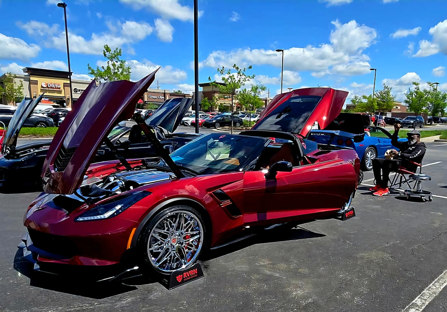 Aftermarket forged and chrome deep dish wheels for a red 2017 Corvette C7 Grand Sport models