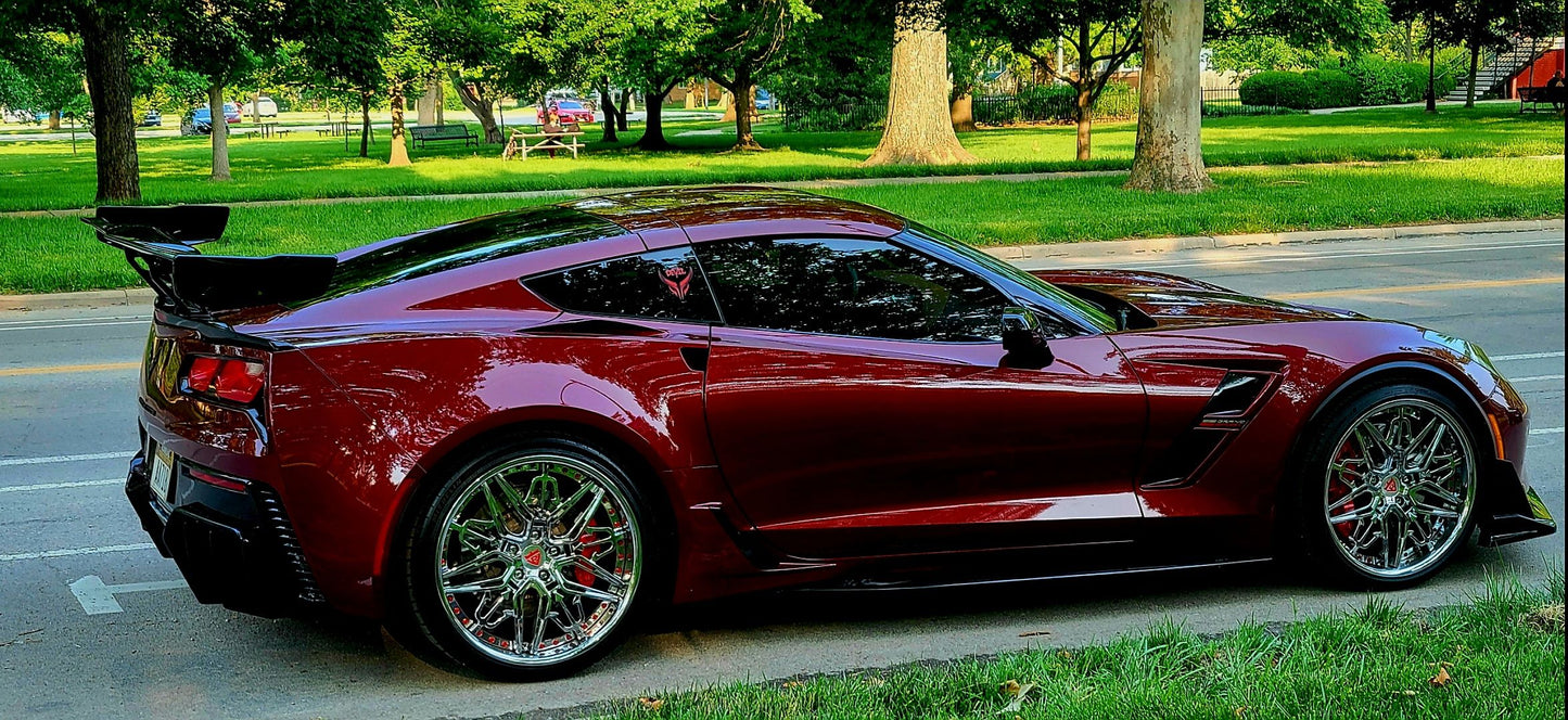 Aftermarket forged and chrome deep dish wheels for a red 2017 Corvette C7 Grand Sport models