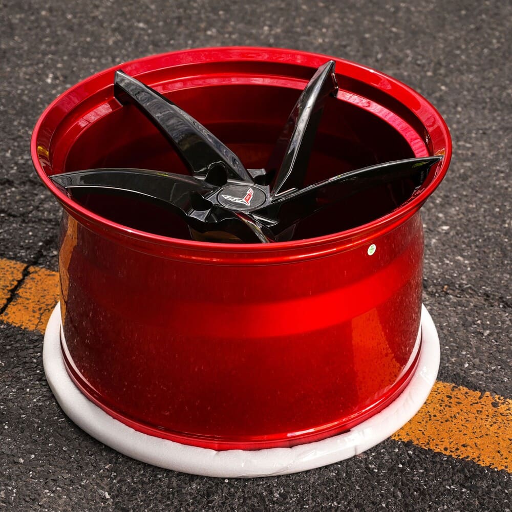 Corvette C8 Z06 / E-Ray 5 Spoke Wheels Collection featuring a red wheel with black spokes, perfect for Corvette aftermarket wheels.