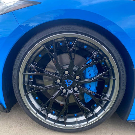 Rapid Blue Corvette C8 Z51 with a set of custom forged 2-piece wheels in gloss black face, gunmetal lip and rapid blue screws-customize your own unique rims