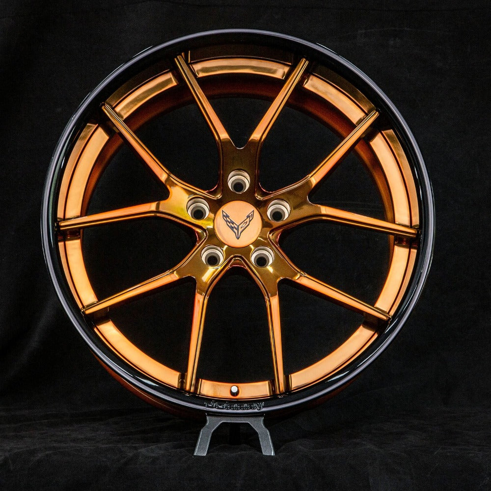 Aftermarket bronze wheels installed on Corvette C8 – rear angle