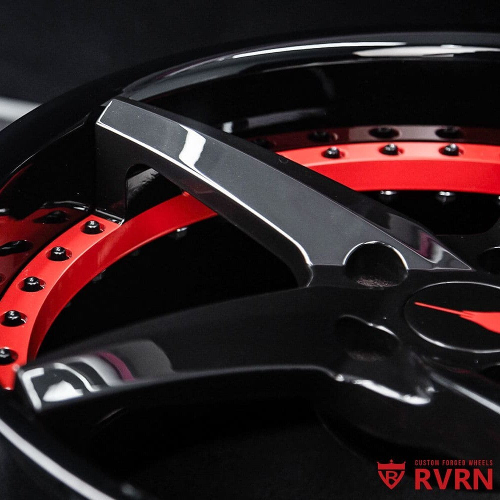 Detailed view of black and red forged wheel design for 2021 Corvette Z51.