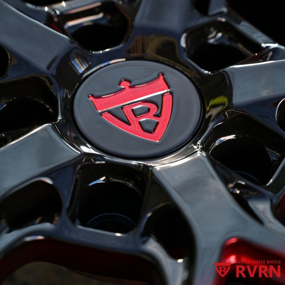 Close-up detail of custom red and black forged C7 Z06 wheels