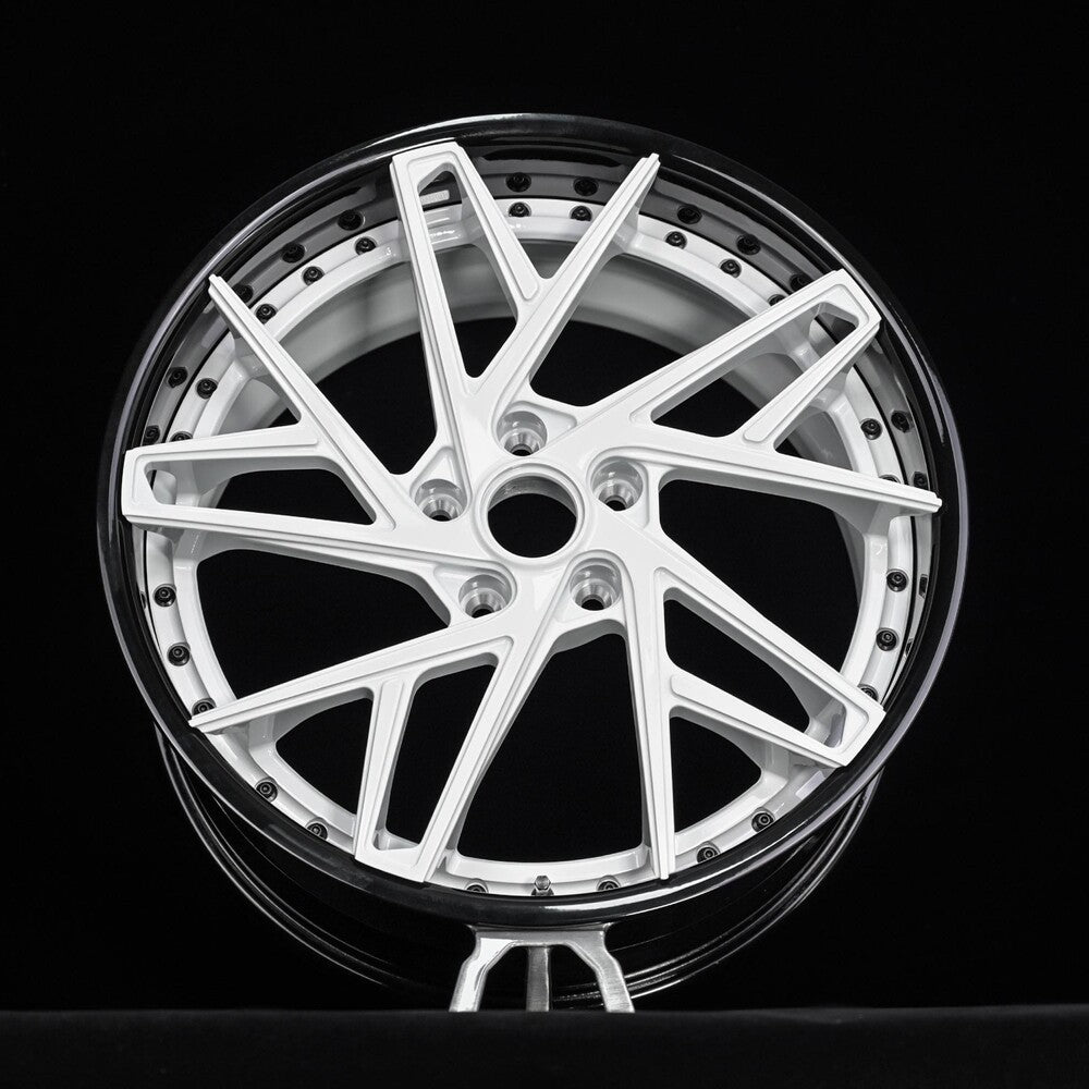 Close-up of gloss black barrel and ivory white spokes on RVRN DS74 forged wheel.