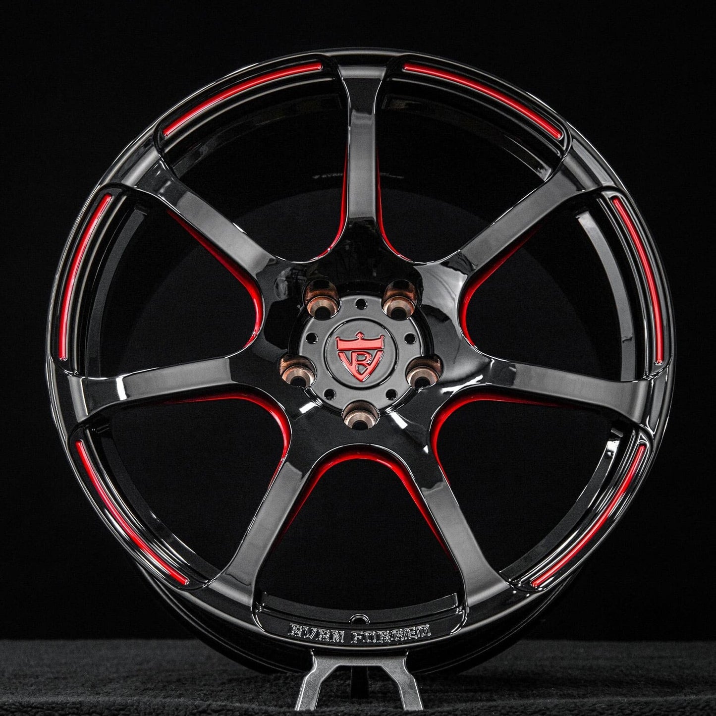 Close-up of transparent red engraving on gloss black MH092 monoblock wheel for Corvette C8 Z51.