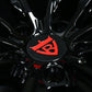 Close-up of custom forged black Corvette C6 Z06 wheel with red logo detail
