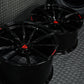 Custom forged Corvette C6 Z06 black wheels with a sleek design and red logo, showcasing high-quality craftsmanship.