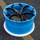 Close-up of Rapid Blue RVRN forged wheels on a sleek Corvette C8