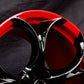 	Detailed shot of Corvette custom wheels with black/red color combo
