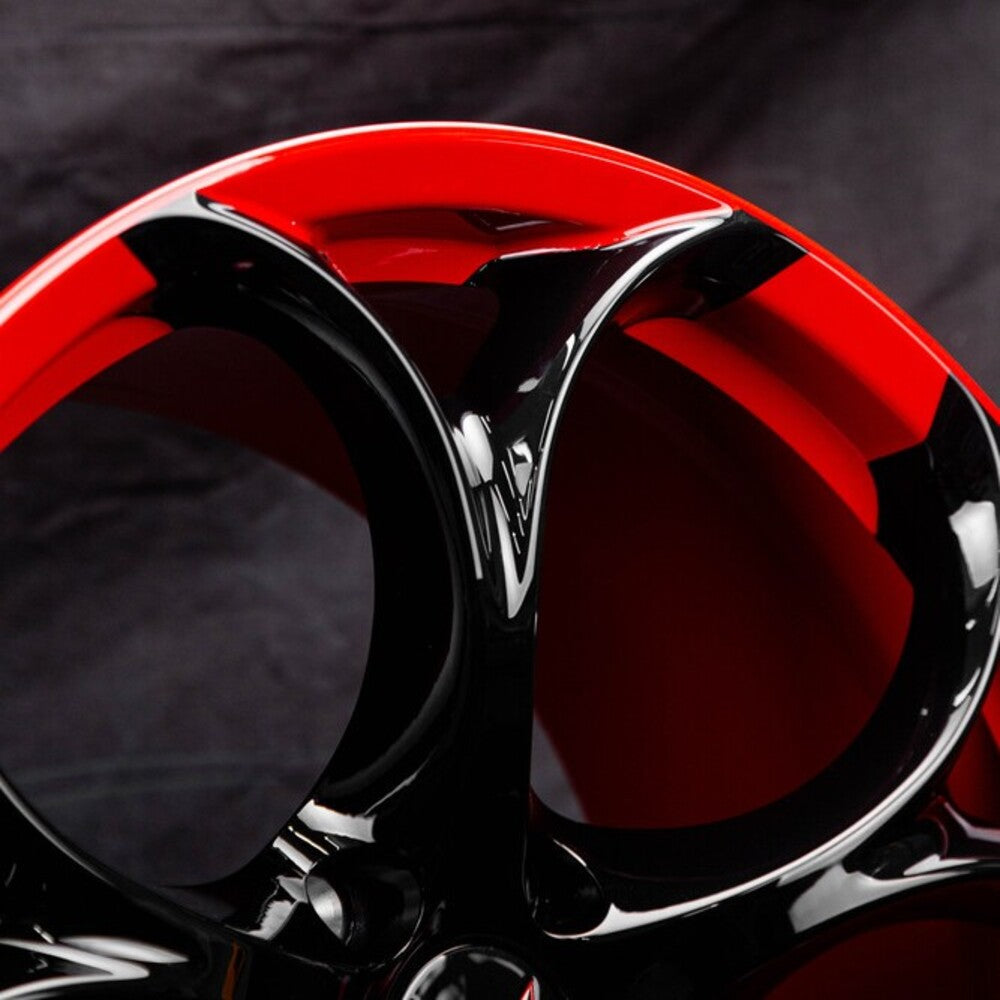 	Detailed shot of Corvette custom wheels with black/red color combo