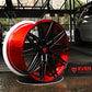 Custom forged black and red RVRN wheels displayed in a garage setting, showcasing high-performance design for Corvette C8.