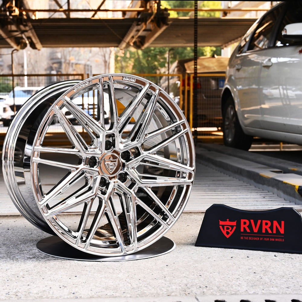 Custom forged chrome wheels for Corvette C8 Stingray, showcasing high-performance design and style in a sleek urban setting.