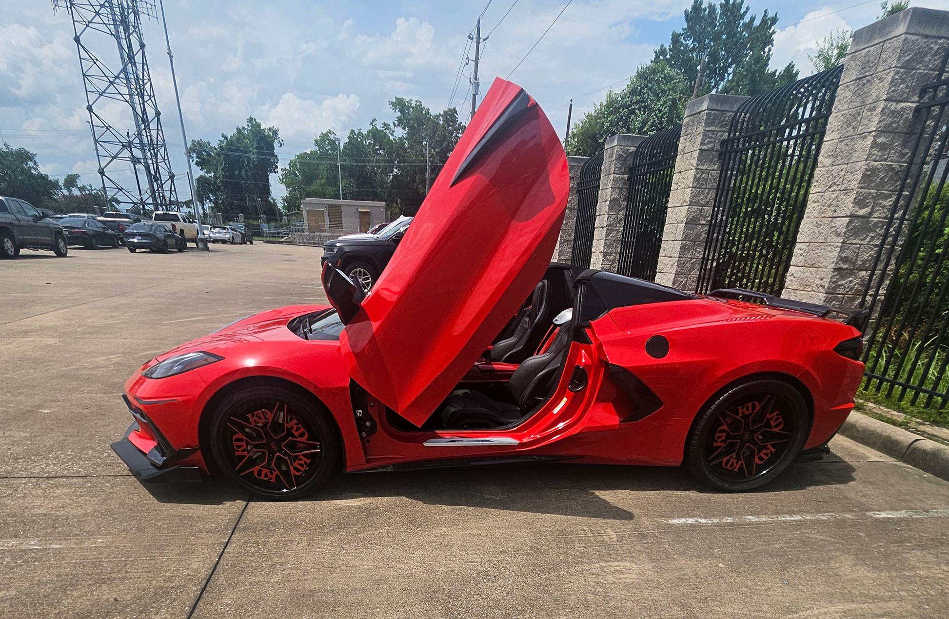	Gloss red hardware on custom Corvette C8 forged wheels