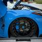 Blue Corvette C8 showcasing custom forged carbon flash wheels with detailed brake calipers.