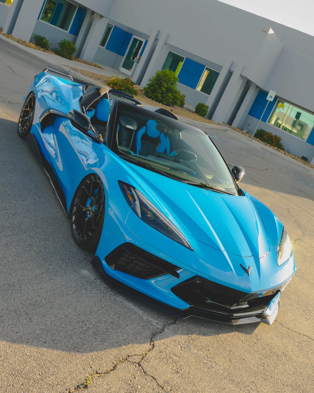 Custom blue Corvette C8 Stingray convertible showcasing sleek lines and aftermarket performance design.