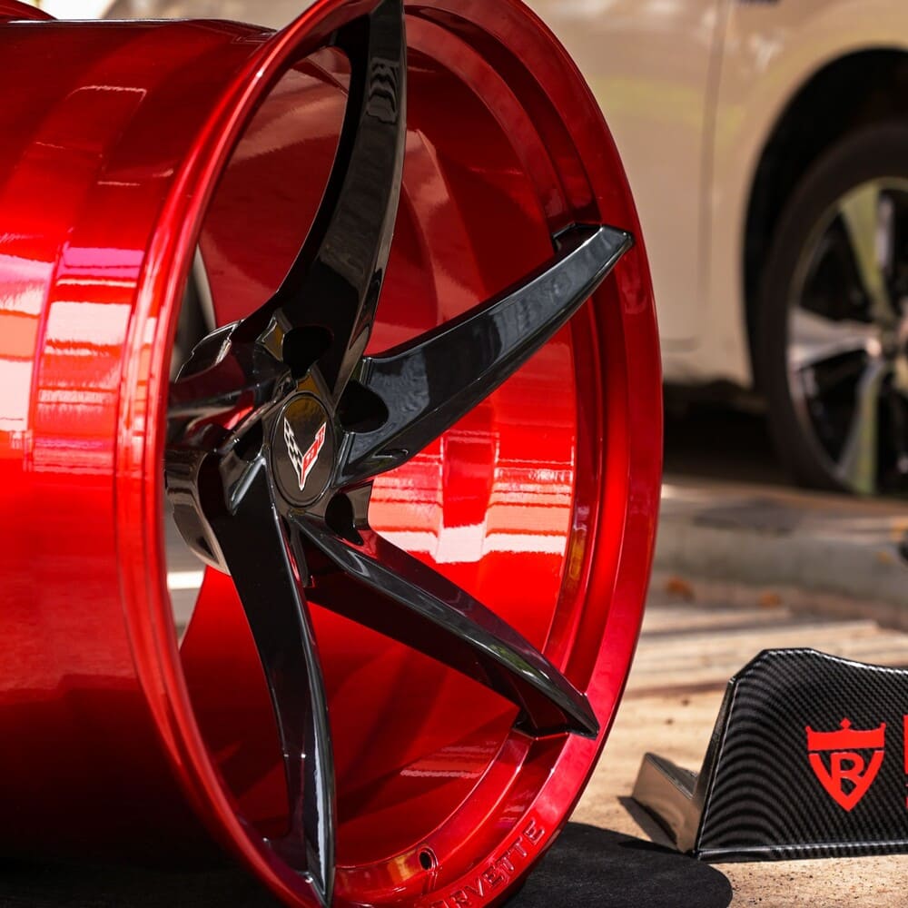 Close-up of gloss black spokes with Black Cherry barrel