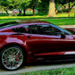 Aftermarket forged and chrome deep dish wheels for a red 2017 Corvette C7 Grand Sport models