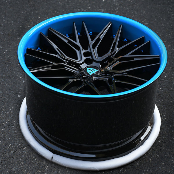 Custom forged Corvette C8 Z06 deep concave wheel in Rapid Blue and black, showcasing intricate design and quality finish.