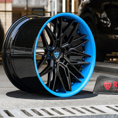 Custom forged black and rapid blue wheel for Corvette C8 Z06, featuring deep concave design and premium finish.